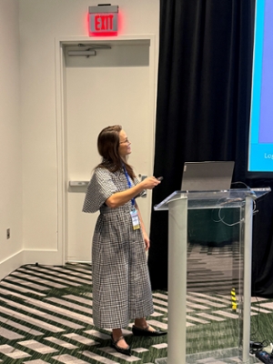 Chelsea Mockbee giving talk at symposium to guest